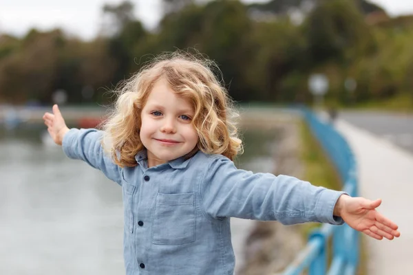 Happy Little Boy Long Blond Hair Posing Arms Outstretched River — Stock Photo, Image