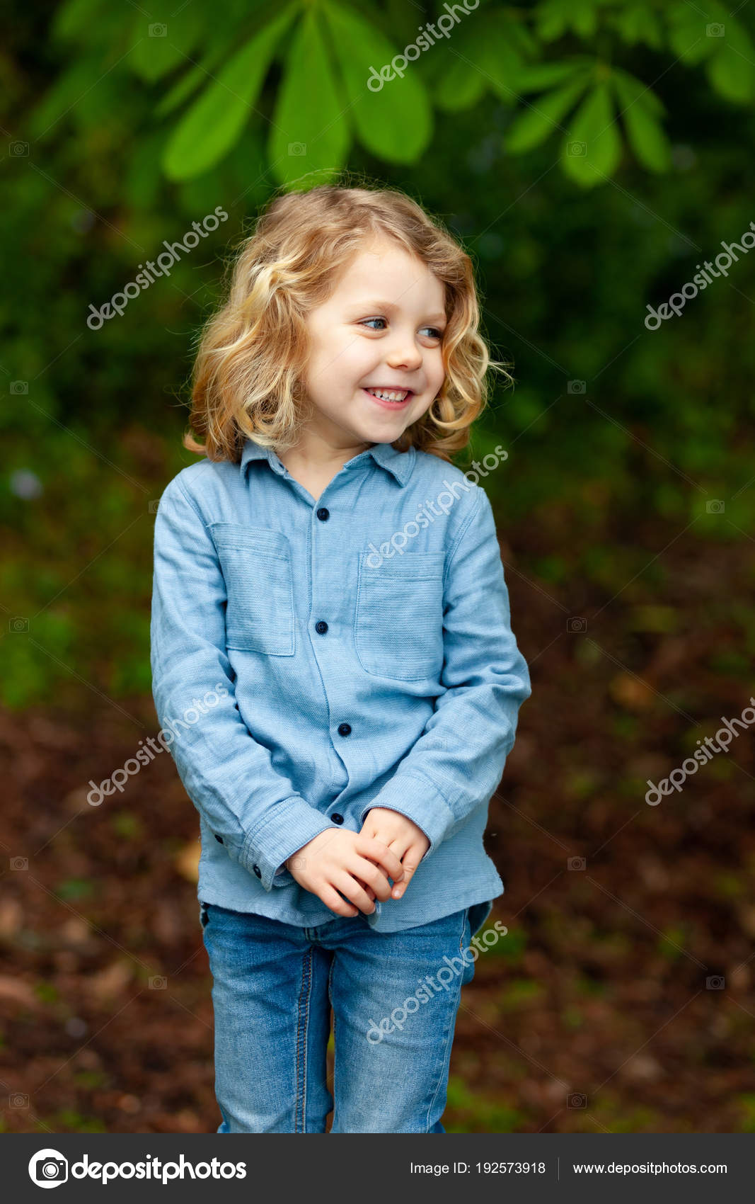 Happy Little Boy Long Blond Hair Enjoying Nature Stock Photo