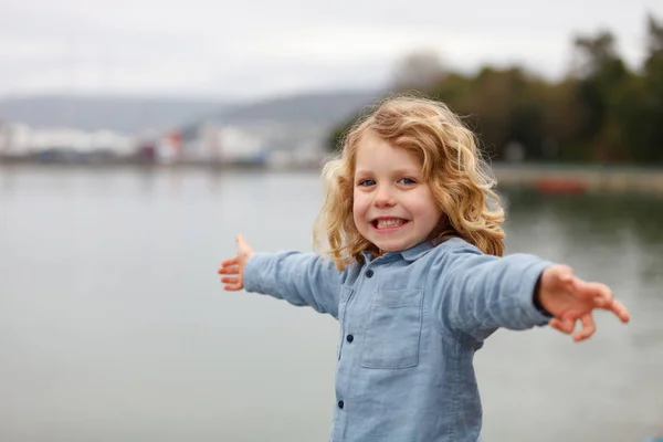 Happy Little Boy Long Blond Hair Posing Arms Outstretched River — Stock Photo, Image
