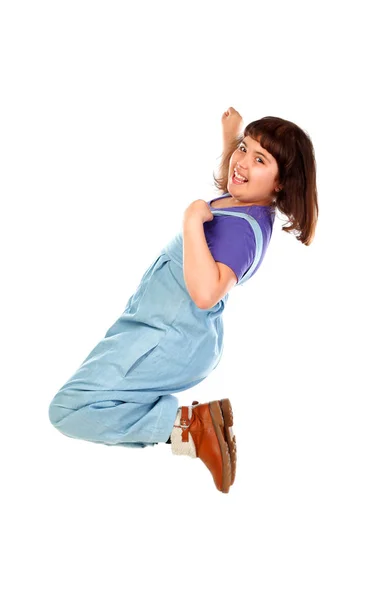 Милая Улыбающаяся Маленькая Девочка Джинсовой Одежде Прыгающая Белом Фоне — стоковое фото