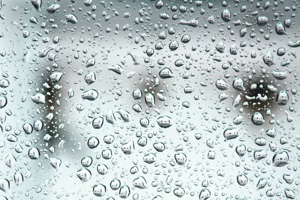 Gotas sobre la superficie blanca — Foto de Stock