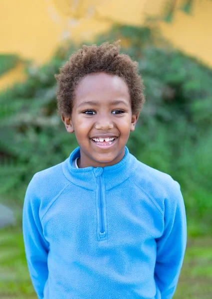 Happy african child with blue jersey — Stock Photo, Image