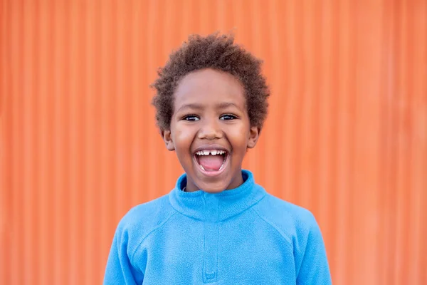 Funny african child with blue jersey — Stock Photo, Image