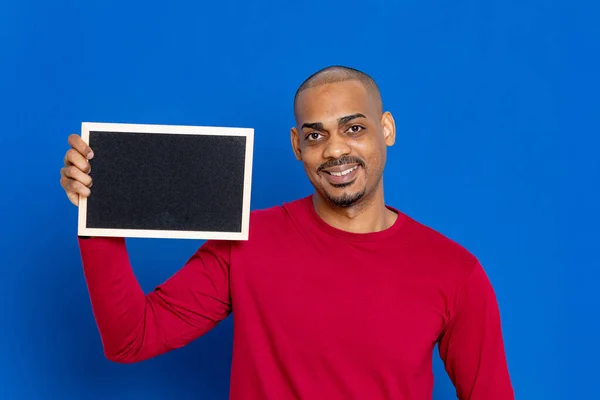 African Guy Red Jersey Blue Background — Stock Photo, Image