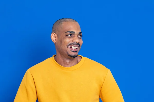 African Guy Yellow Jersey Blue Background — Stock Photo, Image
