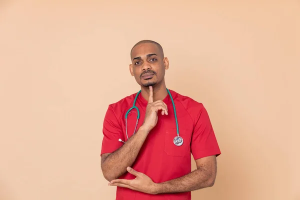 Pensive African Doctor Orange Background — Stock Photo, Image