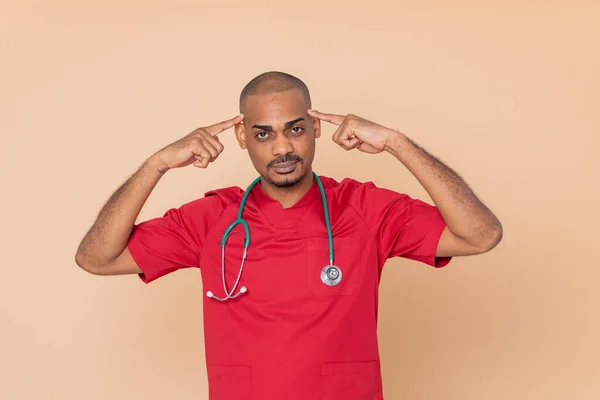 Médico Africano Pensativo Sobre Fondo Naranja —  Fotos de Stock