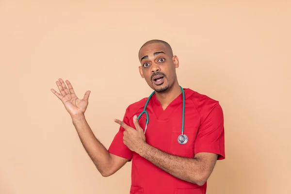 African Doctor Wearing Red Uniform Orange Background — Stock Photo, Image