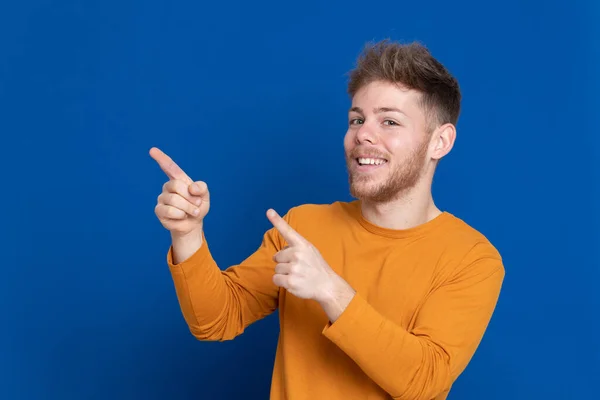 Attractive Young Guy Yellow Shirt Blue Background — Stock Photo, Image