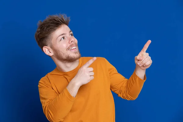 Attractive Young Guy Yellow Shirt Blue Background — Stock Photo, Image