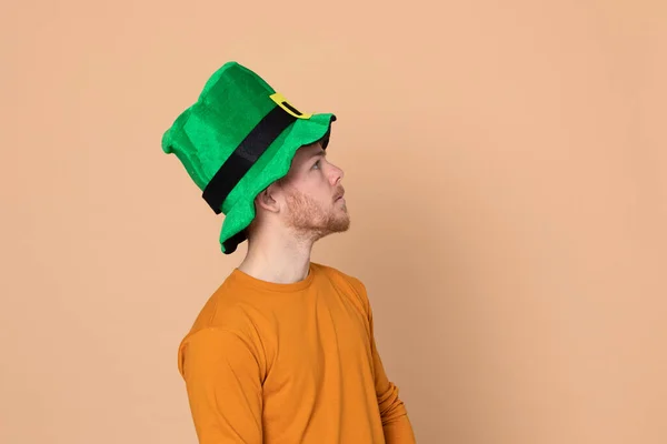 Attractive Young Guy Big Green Hat Yellow Background — Stock Photo, Image
