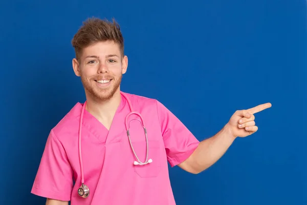 African Doctor Wearing Pink Uniform Blue Background — Stock Photo, Image