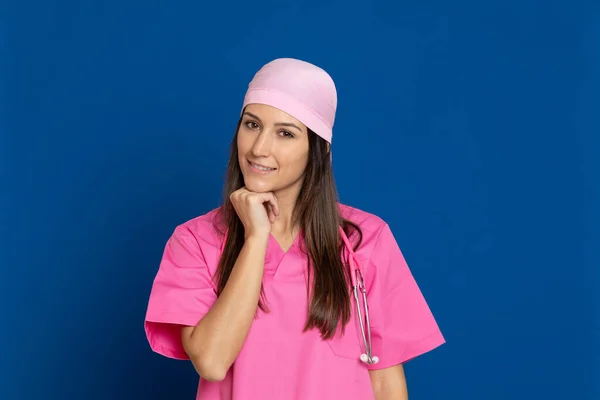 Young Doctor Pink Uniform Blue Background — Stock Photo, Image