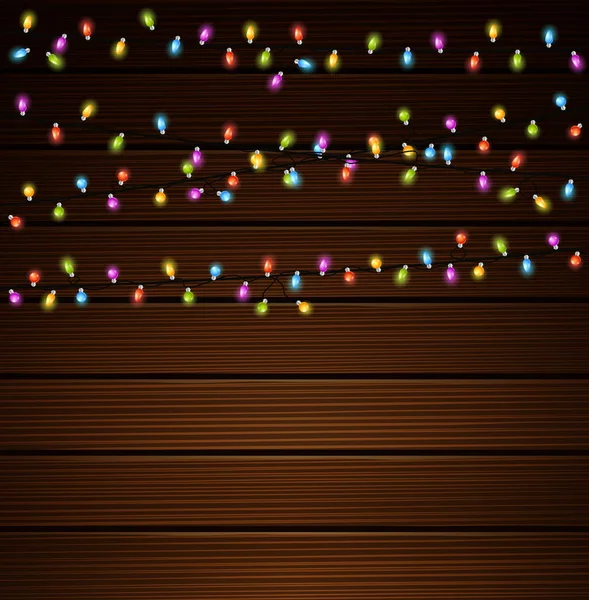 Luces de Navidad sobre fondo de madera — Vector de stock