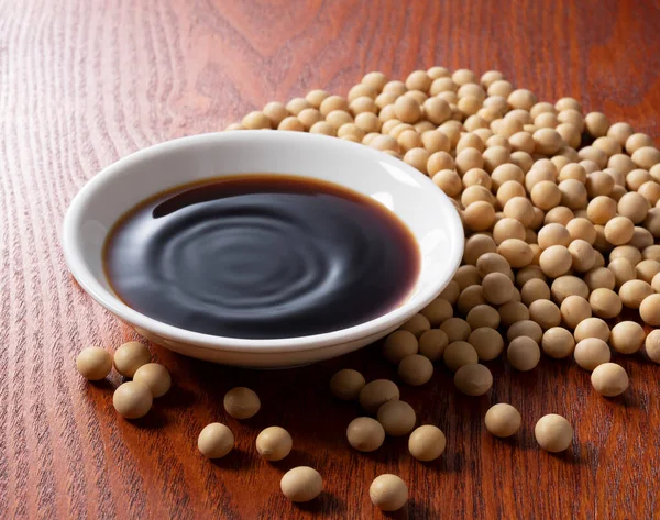 Soy Sauce Plate Soybeans Scattered — Stock Photo, Image