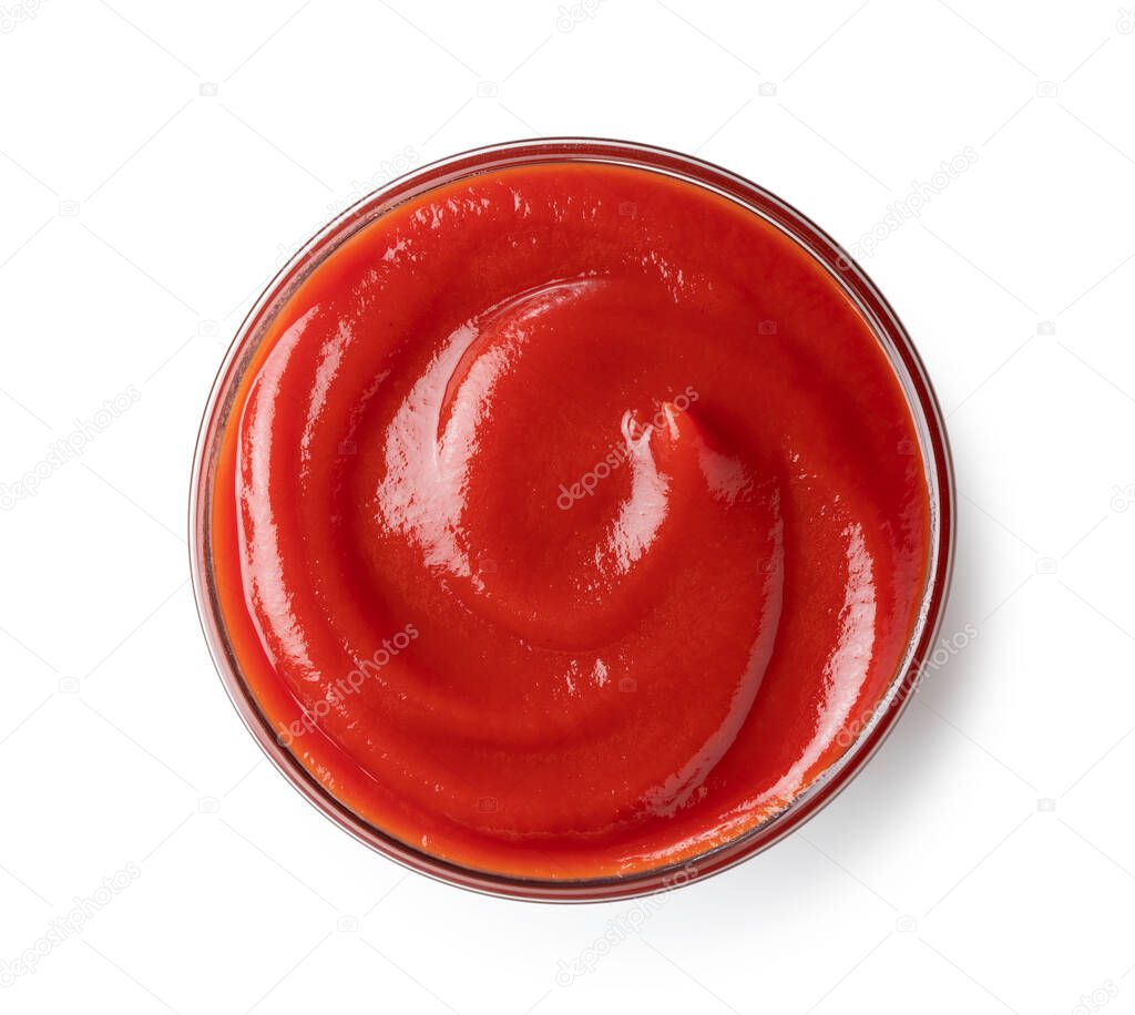Shot from above of ketchup in a glass bowl on a white background