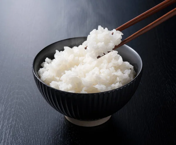 Scooping Rice Chopsticks Black Background — Stock Photo, Image