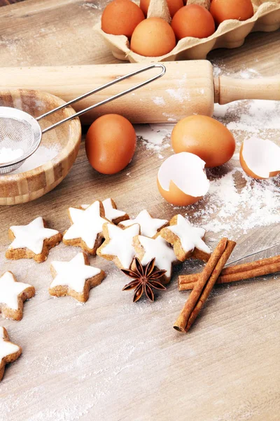 Baking ingredients for homemade pastry on wooden background with