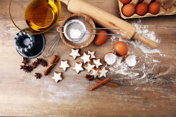 Baking ingredients for homemade pastry on wooden background with