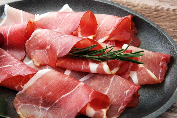 Prosciutto with rosemary  or ham of black forest or serrano — Stock Photo, Image