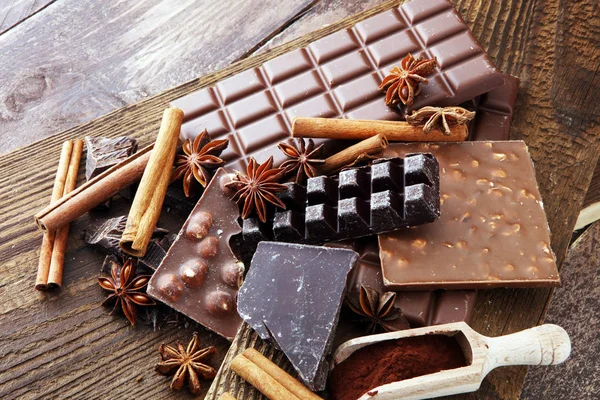 Chocolate concept with assorted chocolate, powder and spice. — Stock Photo, Image