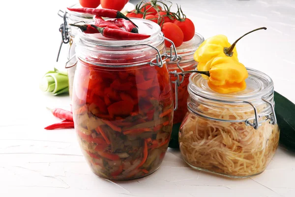 Jars with variety of pickled vegetables. Preserved food — Stock Photo, Image