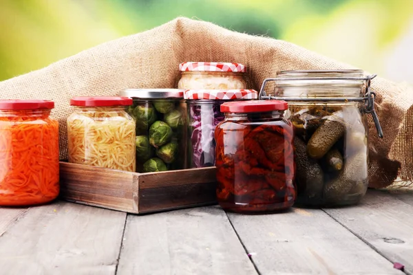 Jars with variety of pickled vegetables. Preserved food. — Stock Photo, Image