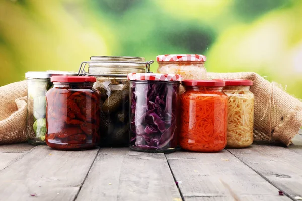 Jars with variety of pickled vegetables. Preserved food. — Stock Photo, Image