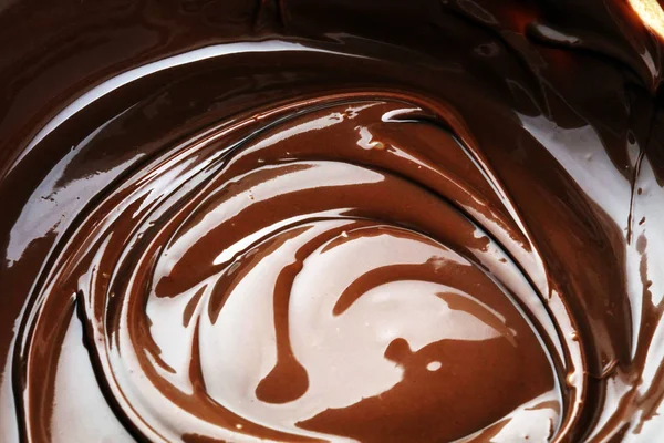 Melting chocolate, melted delicious chocolate for praline icing — Stock Photo, Image