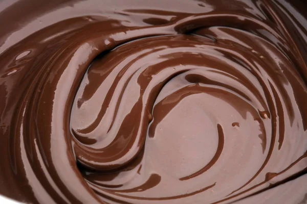 Melting chocolate, melted delicious chocolate for praline icing — Stock Photo, Image