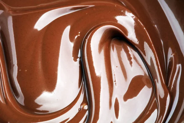 Melting chocolate, melted delicious chocolate for praline icing — Stock Photo, Image