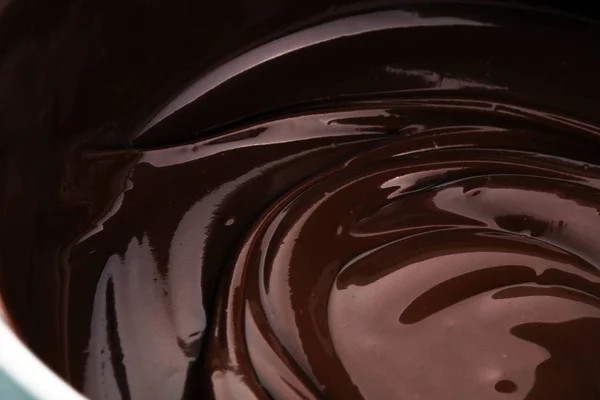 Melting chocolate, melted delicious chocolate for praline icing — Stock Photo, Image