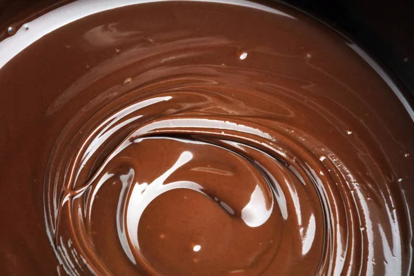 Melting chocolate, melted delicious chocolate for praline icing — Stock Photo, Image