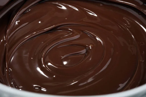 Melting chocolate, melted delicious chocolate for praline icing — Stock Photo, Image