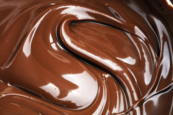 Melting chocolate, melted delicious chocolate for praline icing — Stock Photo, Image