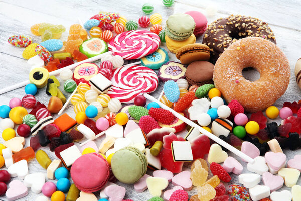 candies with jelly and sugar. colorful array of different childs sweets and treats