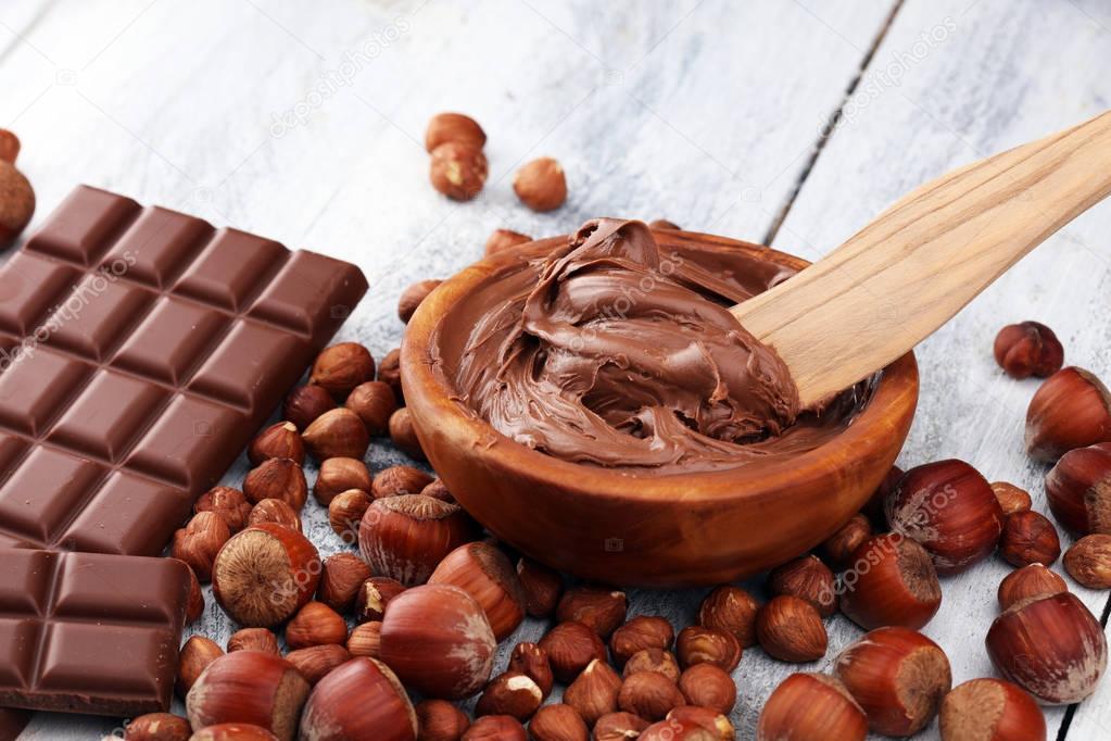 Homemade hazelnut chocolate spread in wooden bowl. Hazelnut Noug