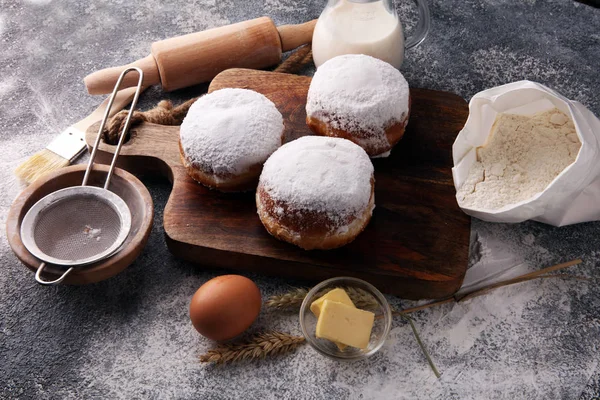 German donuts or berliner with ingredient on grey background. — Stock Photo, Image