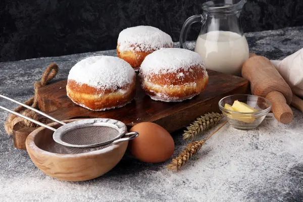 German donuts or berliner with ingredient on grey background. — Stock Photo, Image