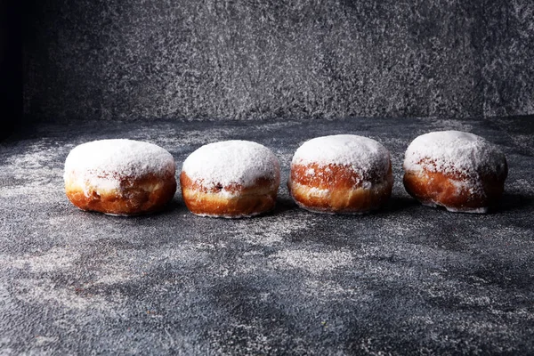 German donuts with jam and icing sugar. Carnival powdered sugar — Stock Photo, Image