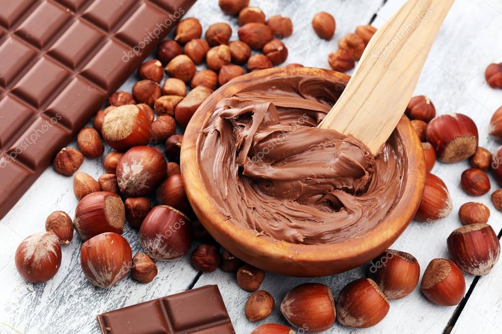 Homemade hazelnut chocolate spread in wooden bowl. Hazelnut Noug