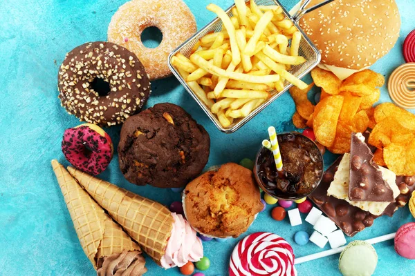 Unhealthy products. food bad for figure, skin, heart and teeth. — Stock Photo, Image