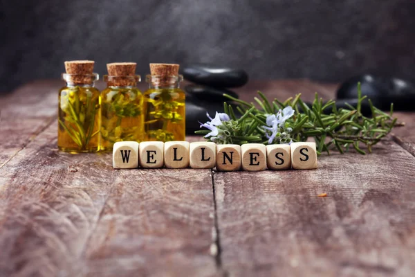Lavender oil in a glass bottle on a background of fresh flowers. — Stock Photo, Image
