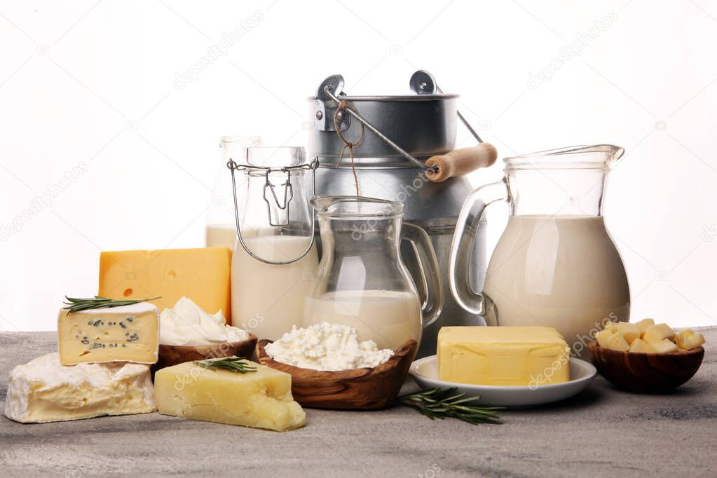 Different  healthy dairy products on rustic background with milk