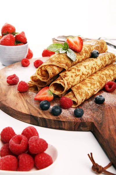 Delicious Tasty Homemade crepes or pancakes with raspberries and — Stock Photo, Image
