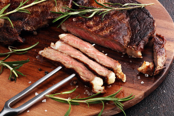 Barbecue Rib Eye Steak or rump steak - Dry Aged Wagyu Entrecote Steak on table