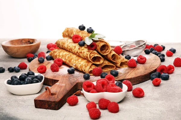 Delicious Tasty Homemade crepes or pancakes with raspberries and — Stock Photo, Image