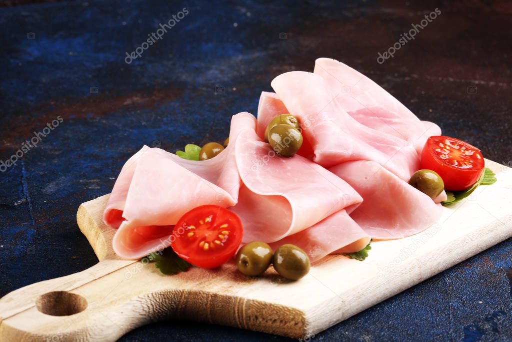 Sliced ham on wooden background. Fresh prosciutto cotto. Tasty P