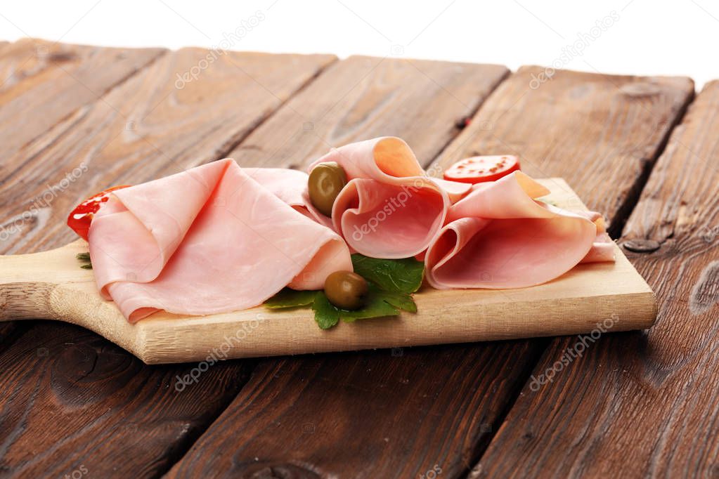 Sliced ham on wooden background. Fresh prosciutto cotto. Tasty P