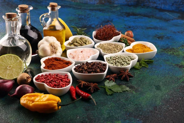 Spices and herbs on table. Food and cuisine ingredients with oil — Stock Photo, Image